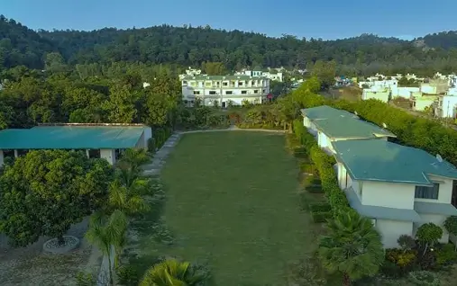 The image shown is Tattwaa Resort, located near Jim Corbett National Park in Uttarakhand, India.