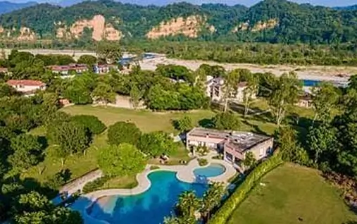 Rustic cottages and scenic river views at hotels and resorts in Jim Corbett.